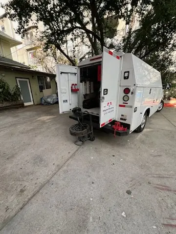 Magnet Plumbing service vehicle on-site for Grease Trap Cleaning in East Bay Drive